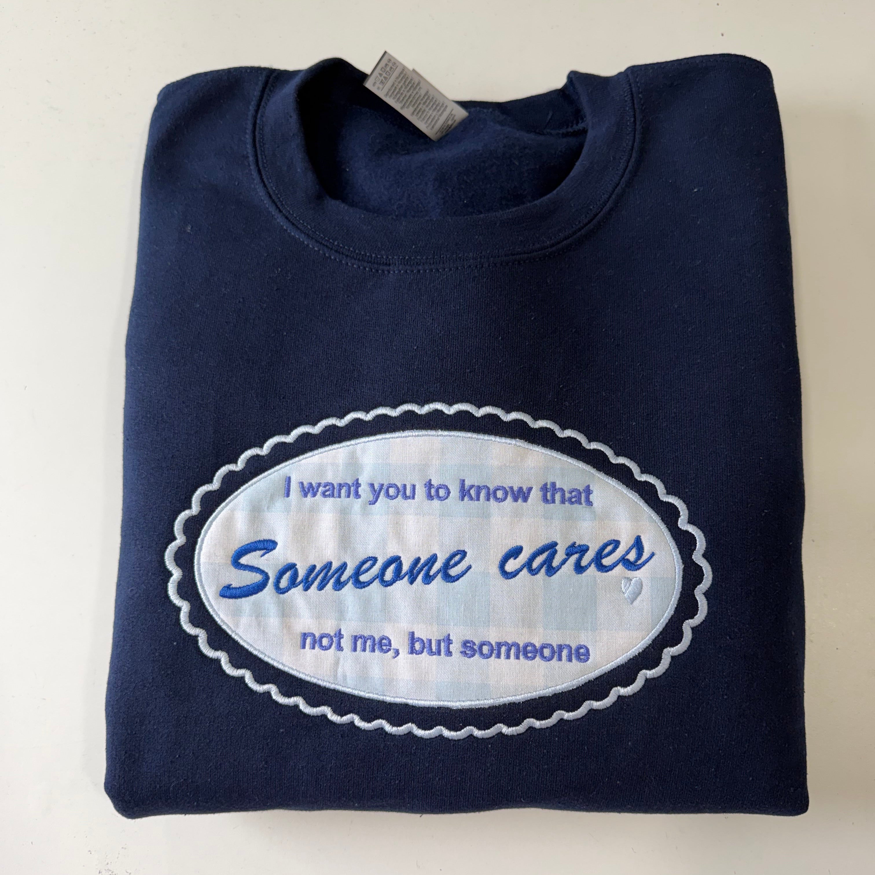 Someone Cares Embroidered Sweatshirt