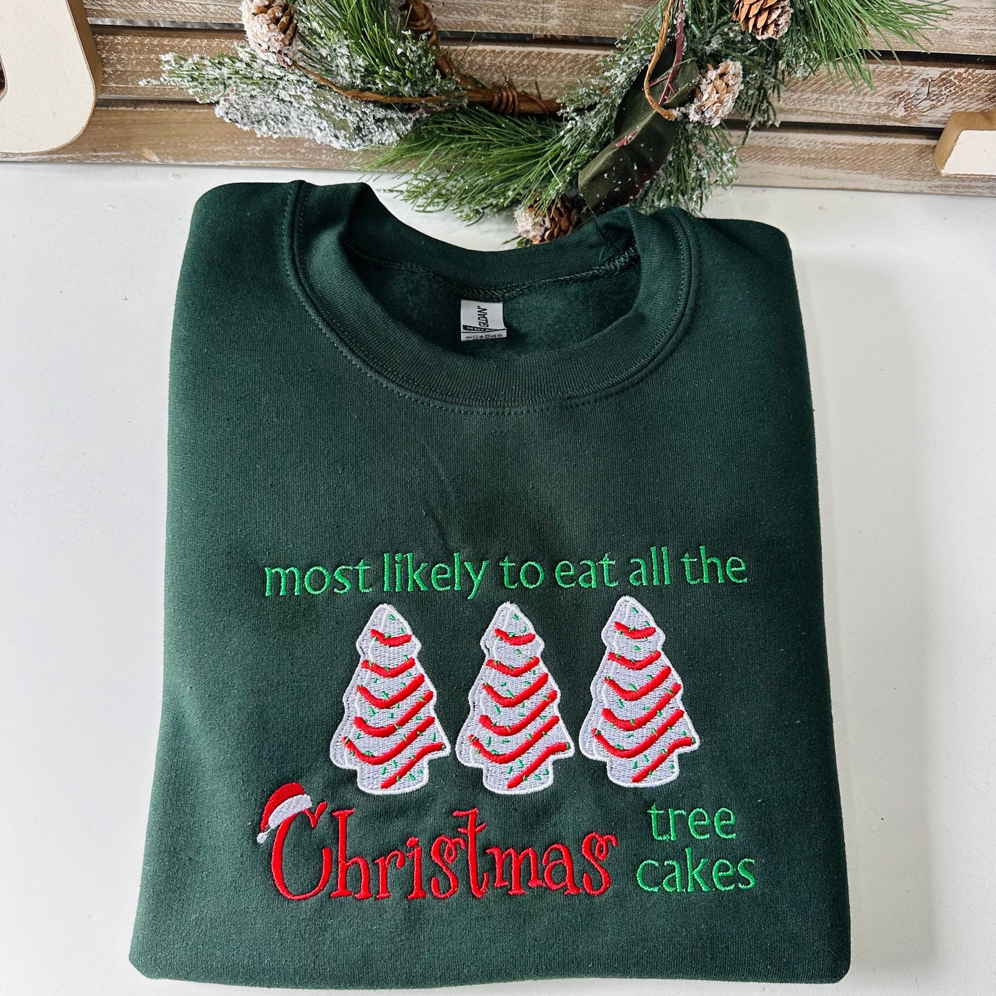 Most Likely to Eat all the Christmas Tree Cakes Embroidered Sweatshirt