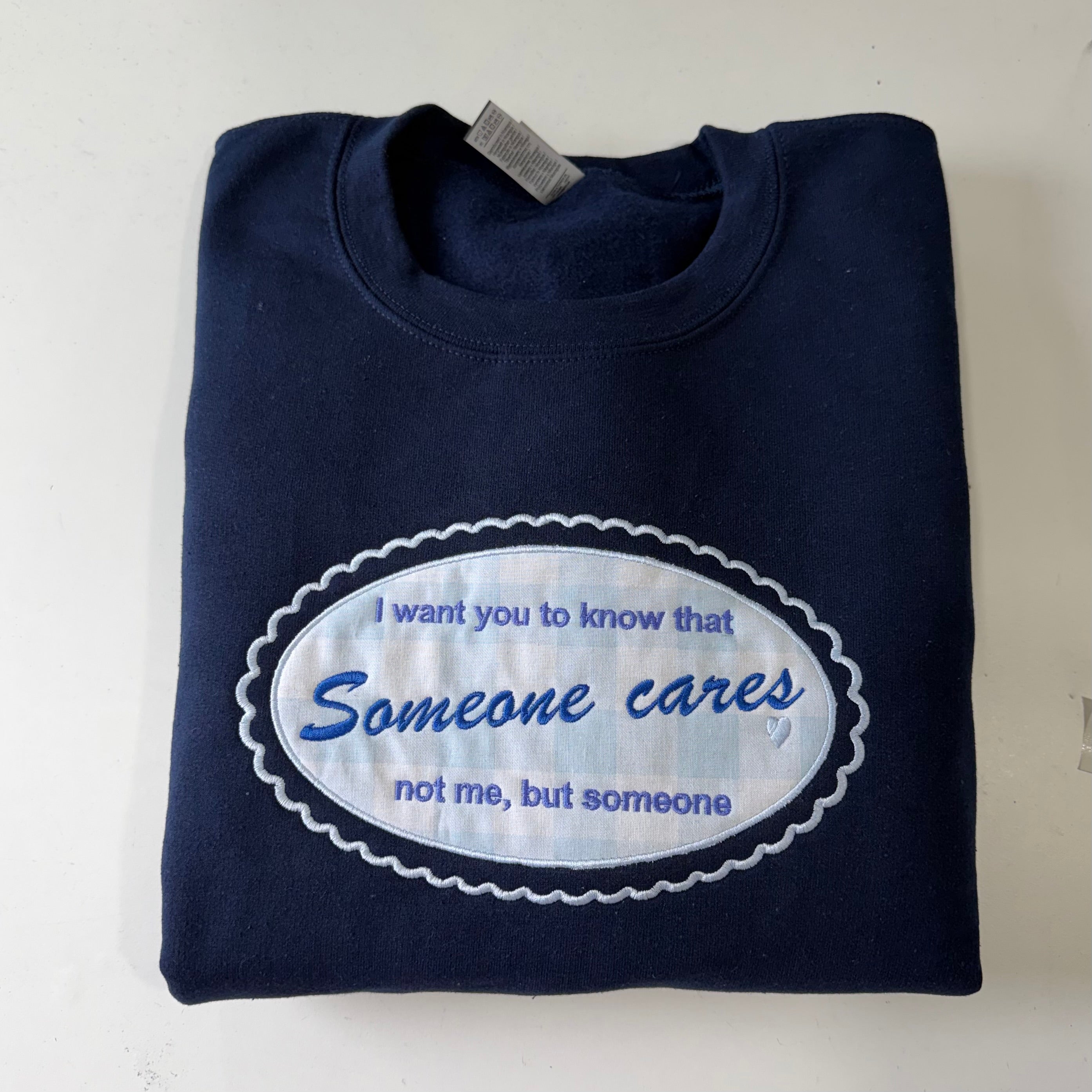 Someone Cares Embroidered Sweatshirt